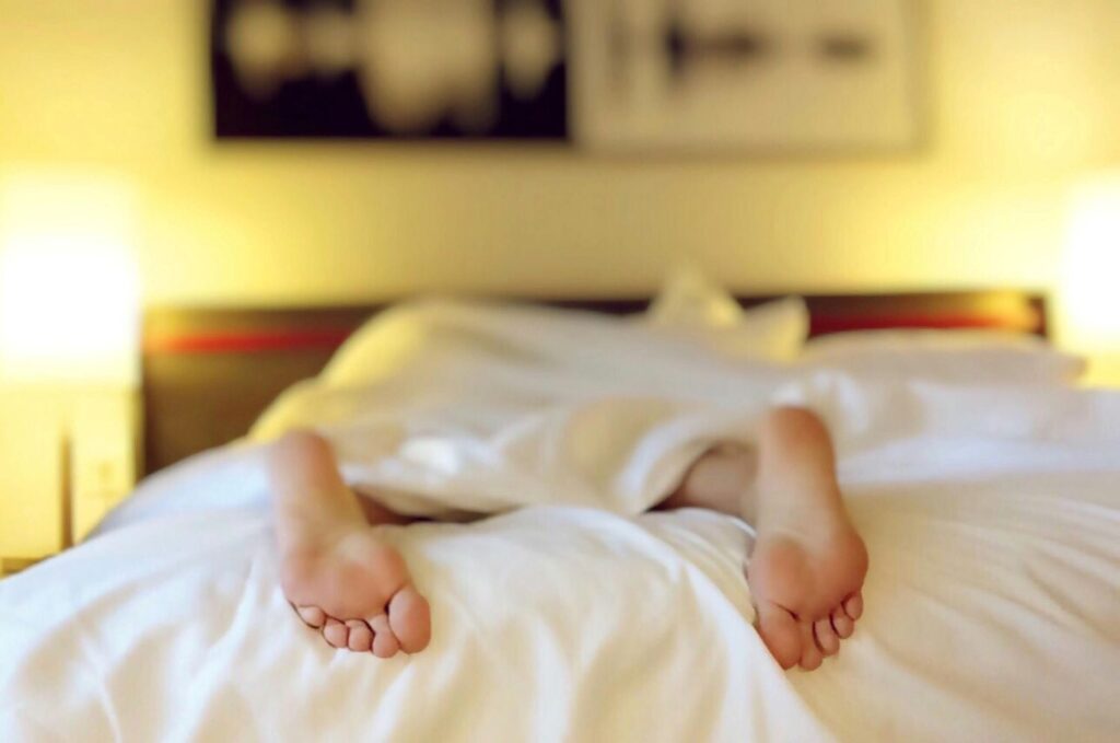 Feet pictured in bad sleep position.